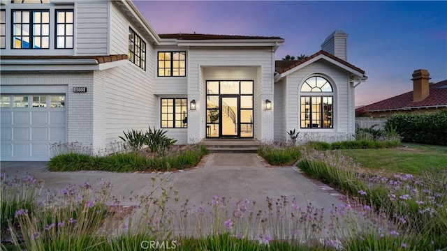 4855 Green Crest Dr, Yorba Linda, CA 92887 - view of exterior entry featuring brick siding and a chimney