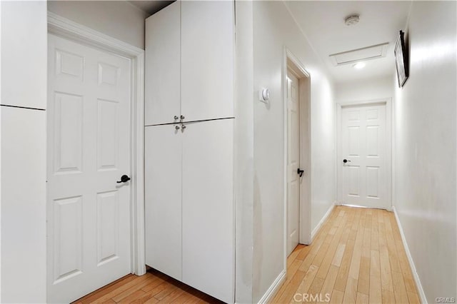 7060 Morse Ave, North Hollywood, CA 91605 - corridor featuring light wood-style flooring and attic access