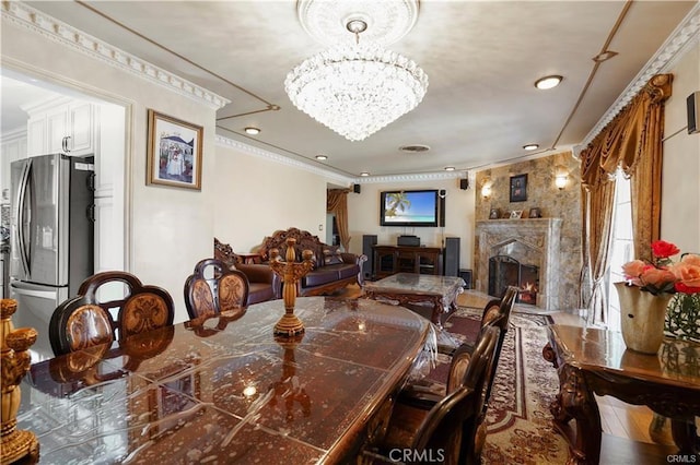 7060 Morse Ave, North Hollywood, CA 91605 - dining space featuring a fireplace, a chandelier, crown molding, and recessed lighting