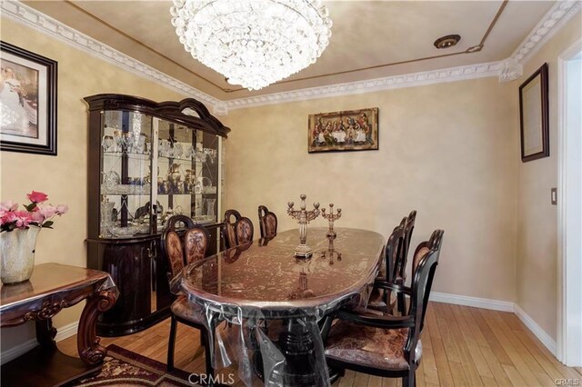 7060 Morse Ave, North Hollywood, CA 91605 - dining room with light wood-type flooring and a chandelier