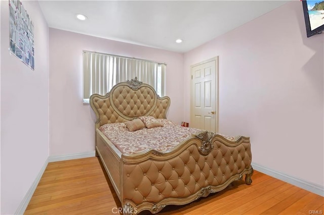 7060 Morse Ave, North Hollywood, CA 91605 - bedroom with light wood finished floors and recessed lighting