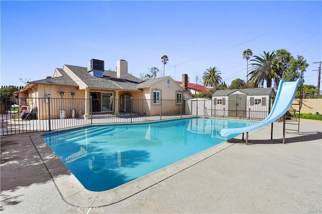 7060 Morse Ave, North Hollywood, CA 91605 - view of swimming pool with a water slide, a shed, and a patio area
