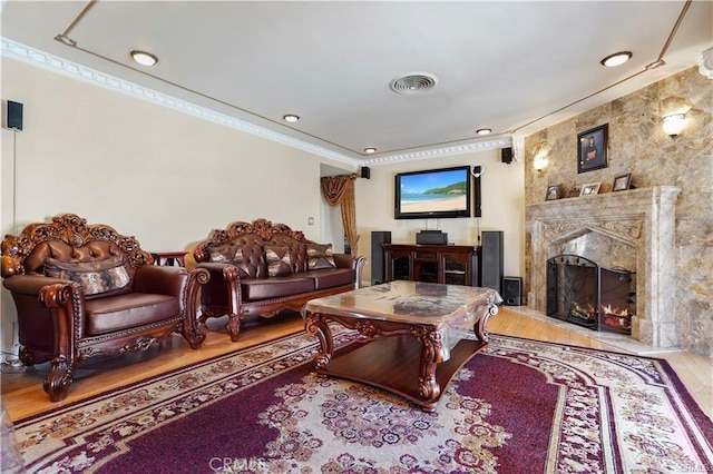 7060 Morse Ave, North Hollywood, CA 91605 - living area featuring a fireplace, wood finished floors, recessed lighting, and ornamental molding