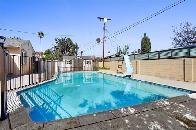 7060 Morse Ave, North Hollywood, CA 91605 - view of pool featuring a water slide and a fenced backyard