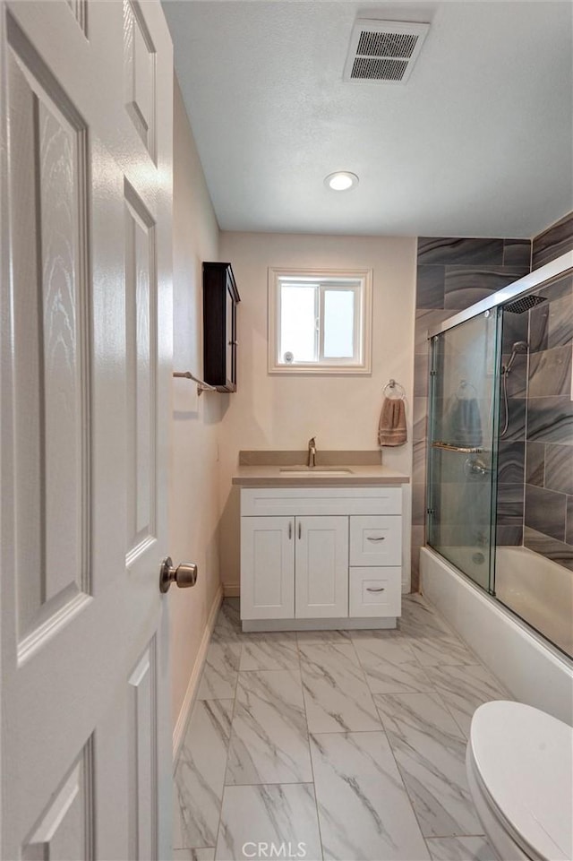 108 Chula St, Monrovia, CA 91016 - bathroom featuring recessed lighting, marble look tile flooring, combined bath / shower with glass door, and vanity