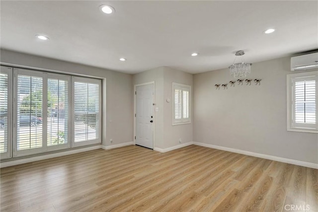 108 Chula St, Monrovia, CA 91016 - foyer featuring a wall unit AC, light wood finished floors, and recessed lighting