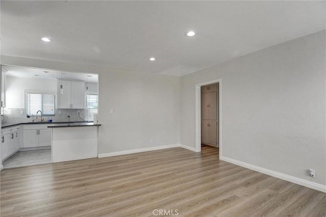 108 Chula St, Monrovia, CA 91016 - unfurnished living room with light wood-style floors and recessed lighting