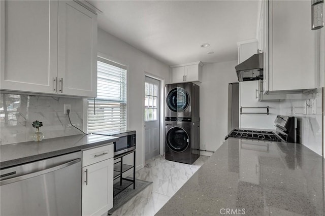 108 Chula St, Monrovia, CA 91016 - kitchen with appliances with stainless steel finishes, estacked washer and dryer, exhaust hood, backsplash, and white cabinetry