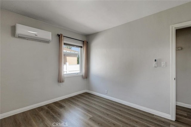 108 Chula St, Monrovia, CA 91016 - empty room with a wall unit AC and wood finished floors