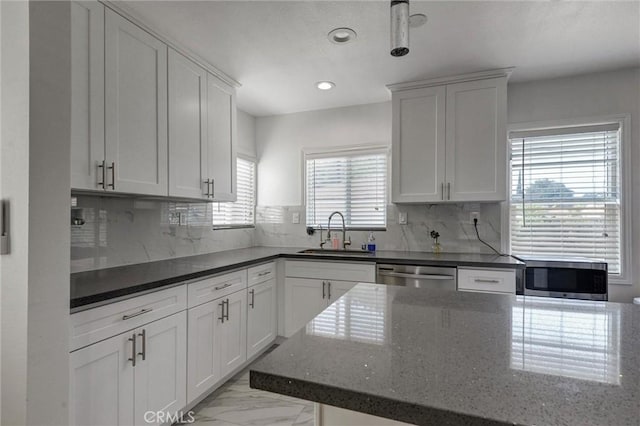 108 Chula St, Monrovia, CA 91016 - kitchen with appliances with stainless steel finishes, light marble finish flooring, recessed lighting, dark stone counters, and white cabinets
