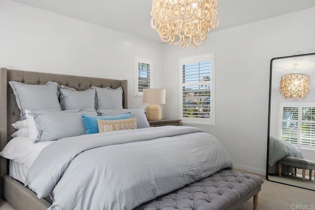 6925 Waters End Dr, Carlsbad, CA 92011 - bedroom with a chandelier and carpet floors