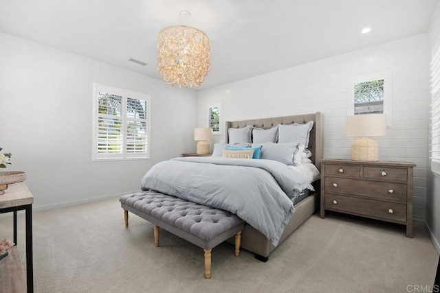 6925 Waters End Dr, Carlsbad, CA 92011 - bedroom with a chandelier and light carpet