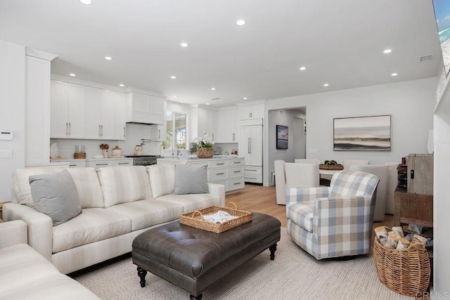 6925 Waters End Dr, Carlsbad, CA 92011 - living room featuring recessed lighting and light wood-style flooring