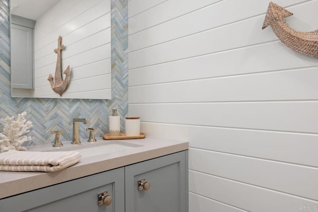 6925 Waters End Dr, Carlsbad, CA 92011 - bathroom featuring tasteful backsplash, vanity, and wooden walls
