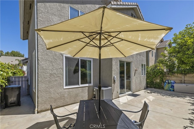 27151 Manor Cir Unit 54, Valencia, CA 91354 - back of property featuring stucco siding, a patio area, and outdoor dining area