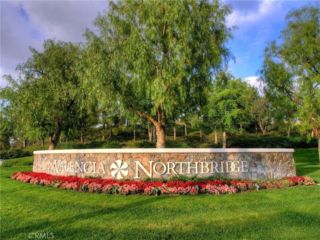 27151 Manor Cir Unit 54, Valencia, CA 91354 - community sign with a yard and view of wooded area