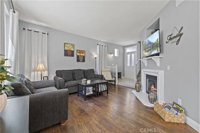 27151 Manor Cir Unit 54, Valencia, CA 91354 - living room featuring dark wood-style floors and a glass covered fireplace