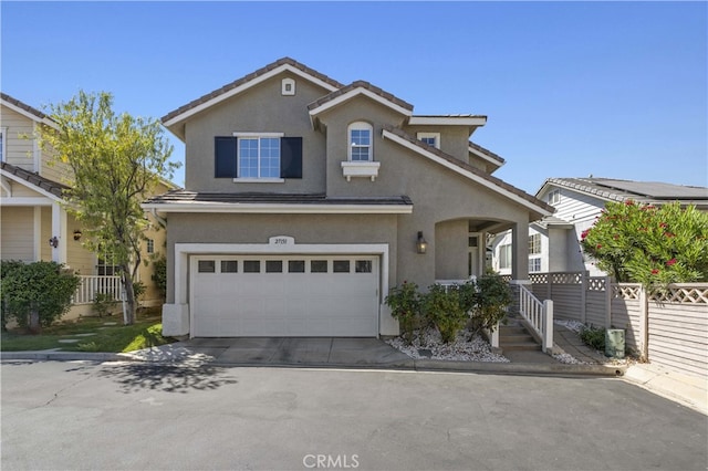 27151 Manor Cir Unit 54, Valencia, CA 91354 - traditional-style house with an attached garage, stucco siding, concrete driveway, and a tile roof