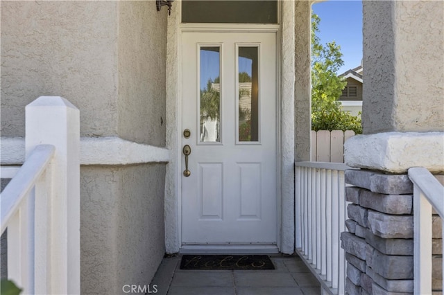 27151 Manor Cir Unit 54, Valencia, CA 91354 - doorway to property featuring stucco siding