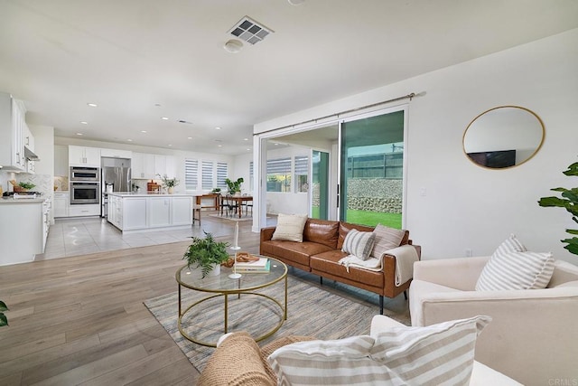 2415 Calle Grandon, Chula Vista, CA 91913 - living room featuring recessed lighting and light wood-style floors