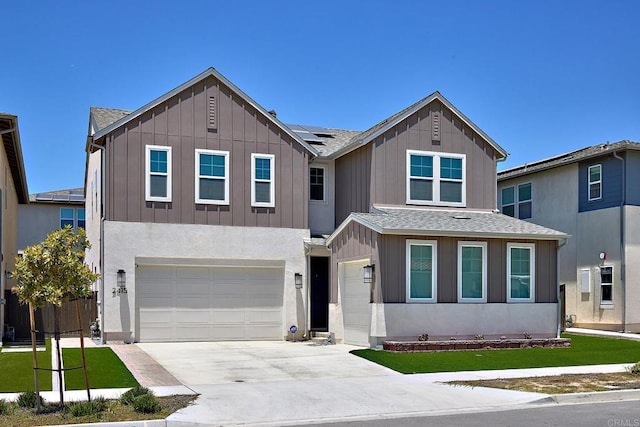 2415 Calle Grandon, Chula Vista, CA 91913 - view of front facade with solar panels, driveway, an attached garage, board and batten siding, and roof with shingles