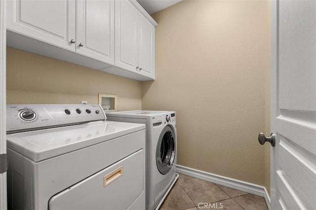 180 Guinevere, Irvine, CA 92620 - laundry area featuring separate washer and dryer, cabinet space, and light tile patterned floors