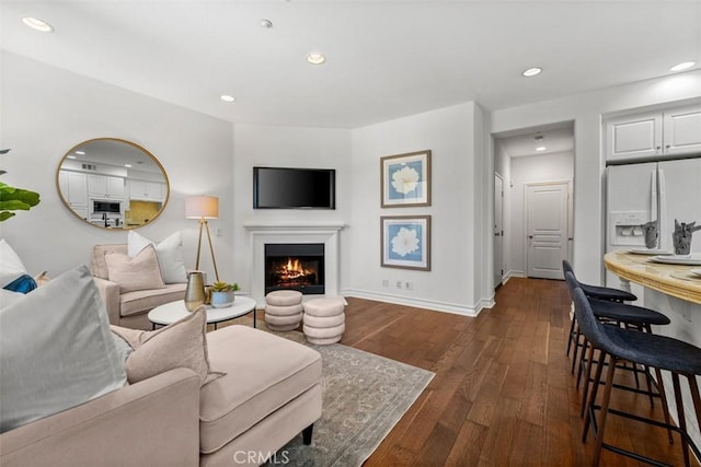 180 Guinevere, Irvine, CA 92620 - living area with dark wood finished floors, recessed lighting, and a warm lit fireplace