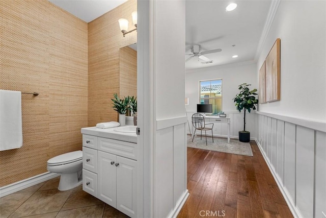 180 Guinevere, Irvine, CA 92620 - bathroom with crown molding, vanity, ceiling fan, recessed lighting, and hardwood / wood-style floors