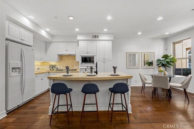 180 Guinevere, Irvine, CA 92620 - kitchen with white appliances, tile counters, white cabinets, decorative backsplash, and dark wood-style flooring