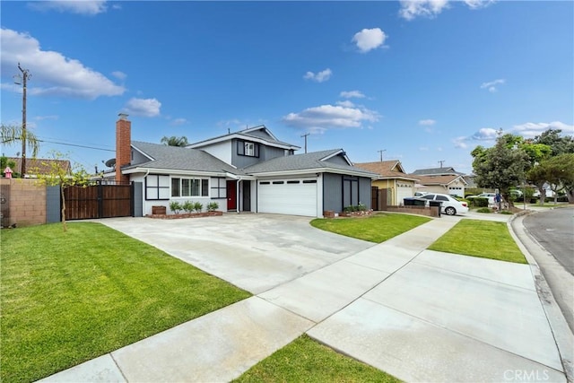 14750 Danbrook Dr, Whittier, CA 90604 - view of front of house featuring driveway, a garage, a chimney, and a gate