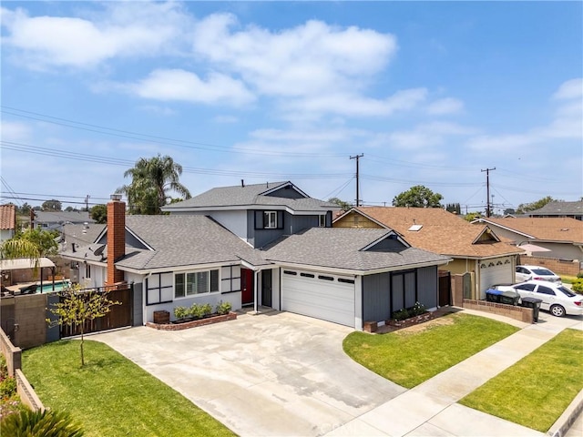 14750 Danbrook Dr, Whittier, CA 90604 - view of front of home featuring roof with shingles, an attached garage, driveway, and a chimney