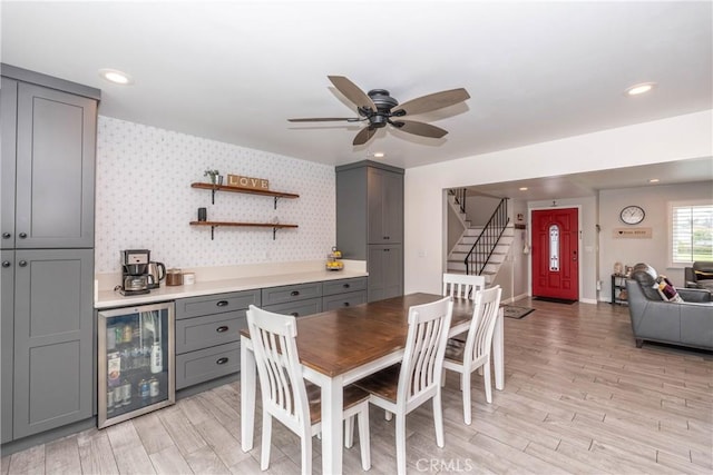 14750 Danbrook Dr, Whittier, CA 90604 - dining room with beverage cooler, stairway, light wood-type flooring, a ceiling fan, and recessed lighting