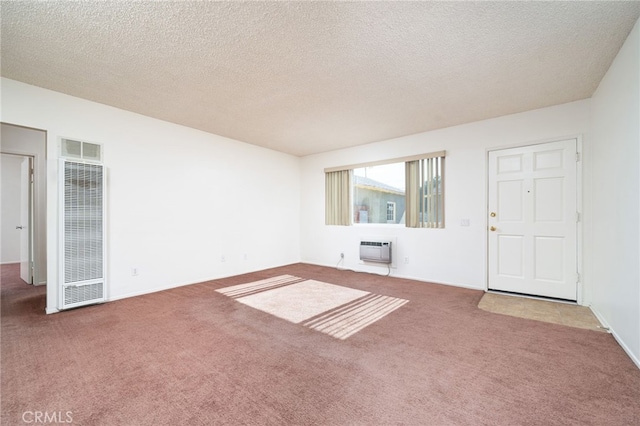 782 Lewis St, Pomona, CA 91767 - unfurnished living room with a heating unit, a wall unit AC, carpet floors, and a textured ceiling