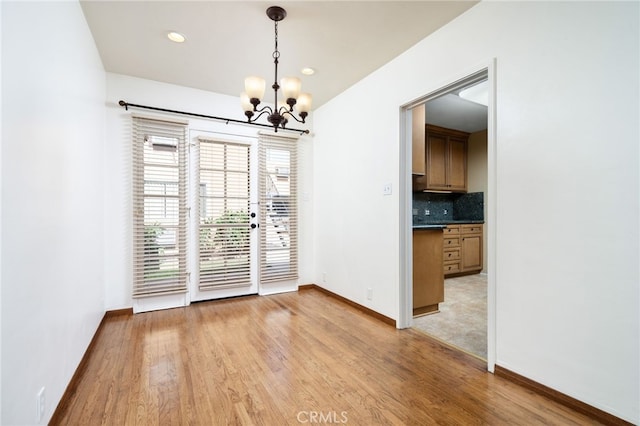 782 Lewis St, Pomona, CA 91767 - unfurnished dining area featuring a chandelier, light wood-type flooring, and recessed lighting