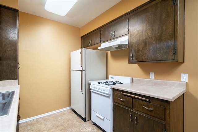 782 Lewis St, Pomona, CA 91767 - kitchen featuring white range with gas cooktop, under cabinet range hood, dark brown cabinetry, and light countertops