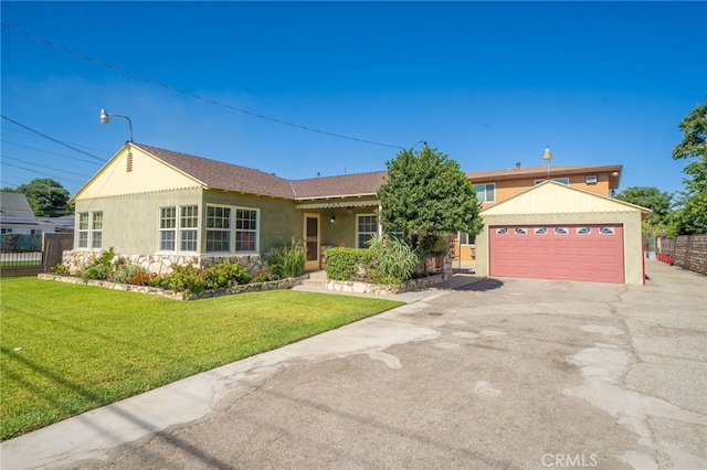 782 Lewis St, Pomona, CA 91767 - ranch-style home featuring asphalt driveway, stucco siding, and stone siding