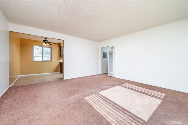 782 Lewis St, Pomona, CA 91767 - spare room featuring a heating unit, carpet flooring, a ceiling fan, and a textured ceiling