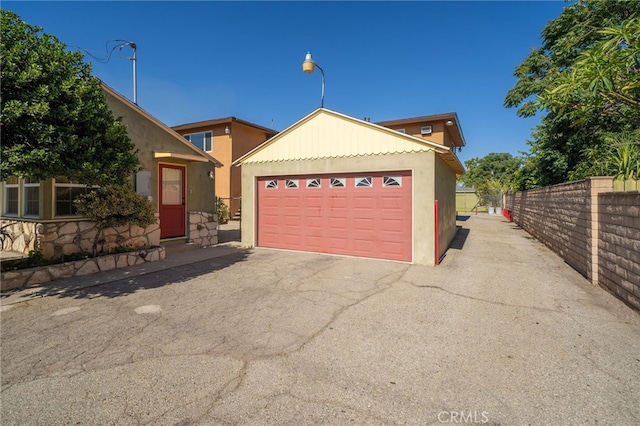 782 Lewis St, Pomona, CA 91767 - view of front of home with driveway, stucco siding, and a garage