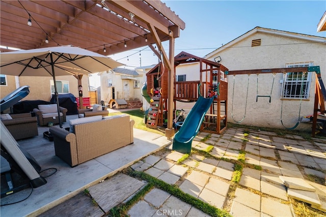 658 W 120th St, Los Angeles, CA 90044 - view of patio / terrace with a playground, an outdoor living space, and a pergola