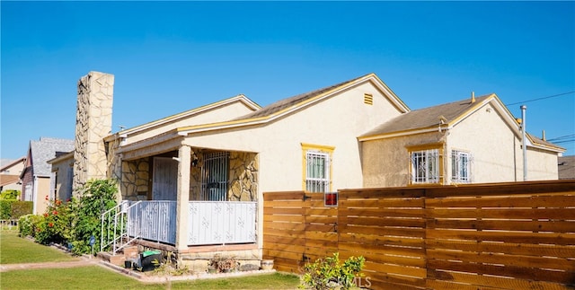 658 W 120th St, Los Angeles, CA 90044 - view of front facade featuring stucco siding