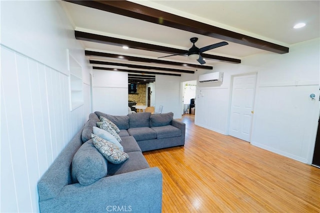 658 W 120th St, Los Angeles, CA 90044 - living room with ceiling fan, light wood-type flooring, beamed ceiling, a wall unit AC, and recessed lighting