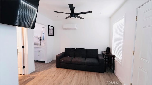 658 W 120th St, Los Angeles, CA 90044 - living room featuring a wall mounted AC, light wood-style floors, healthy amount of natural light, and ceiling fan