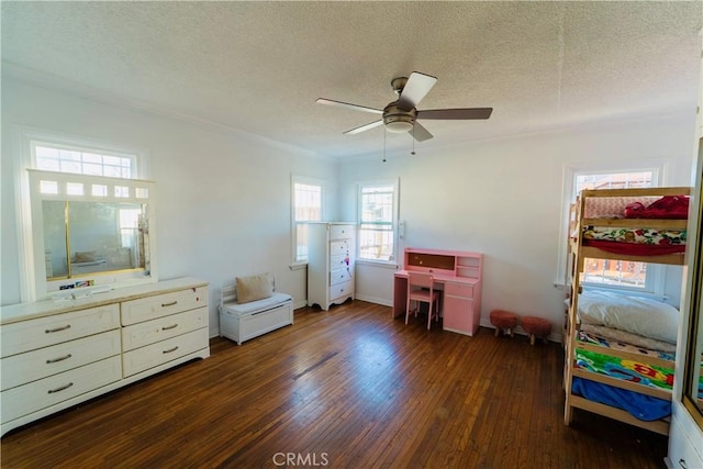 658 W 120th St, Los Angeles, CA 90044 - bedroom featuring dark wood-type flooring, a textured ceiling, and a ceiling fan