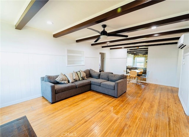 658 W 120th St, Los Angeles, CA 90044 - living area with light wood-style floors, an AC wall unit, ceiling fan, beam ceiling, and wainscoting