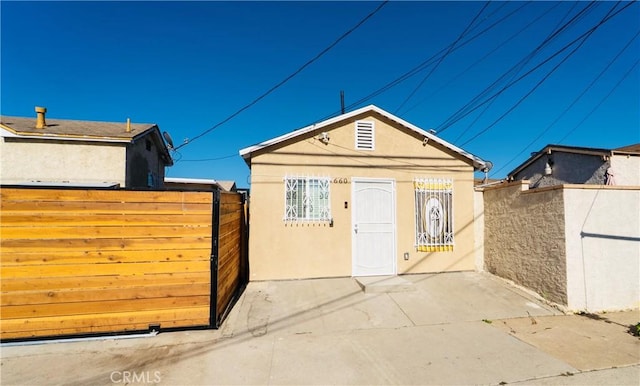 658 W 120th St, Los Angeles, CA 90044 - view of front of house featuring a gate, stucco siding, and a patio