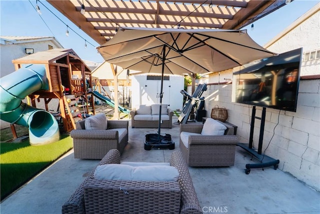 658 W 120th St, Los Angeles, CA 90044 - fenced backyard featuring an outdoor hangout area, a playground, a storage unit, a pergola, and a patio area