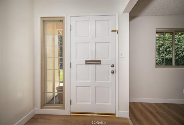 25070 Tulip Ave, Loma Linda, CA 92354 - entrance foyer featuring wood finished floors and a textured ceiling