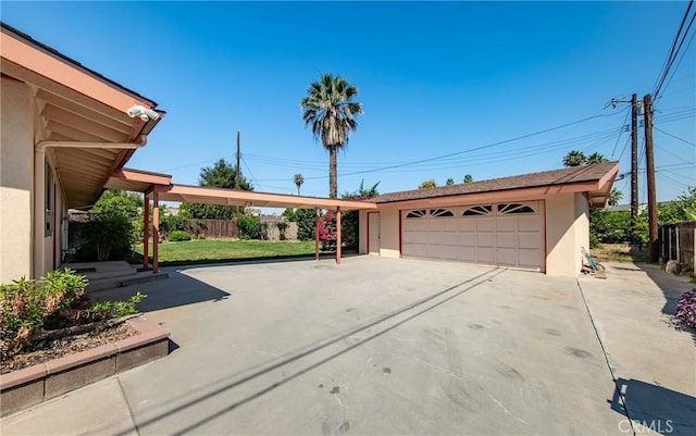 25070 Tulip Ave, Loma Linda, CA 92354 - view of front of house with stucco siding, an outbuilding, and a detached garage