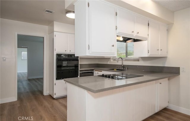 25070 Tulip Ave, Loma Linda, CA 92354 - kitchen with black appliances, wood finished floors, white cabinets, and a peninsula