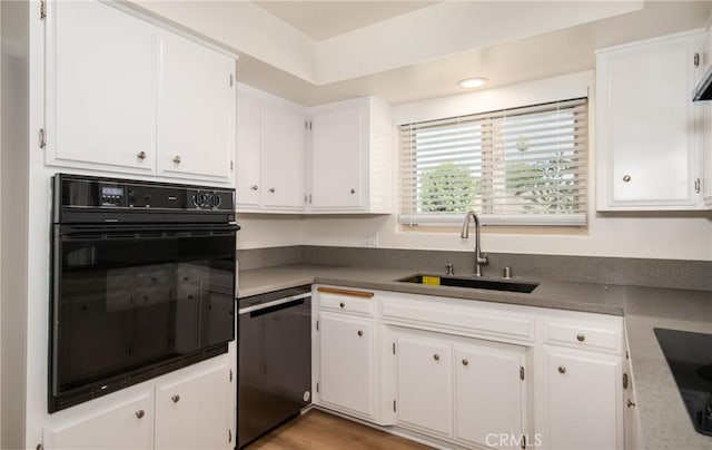 25070 Tulip Ave, Loma Linda, CA 92354 - kitchen featuring black appliances, white cabinetry, and dark countertops